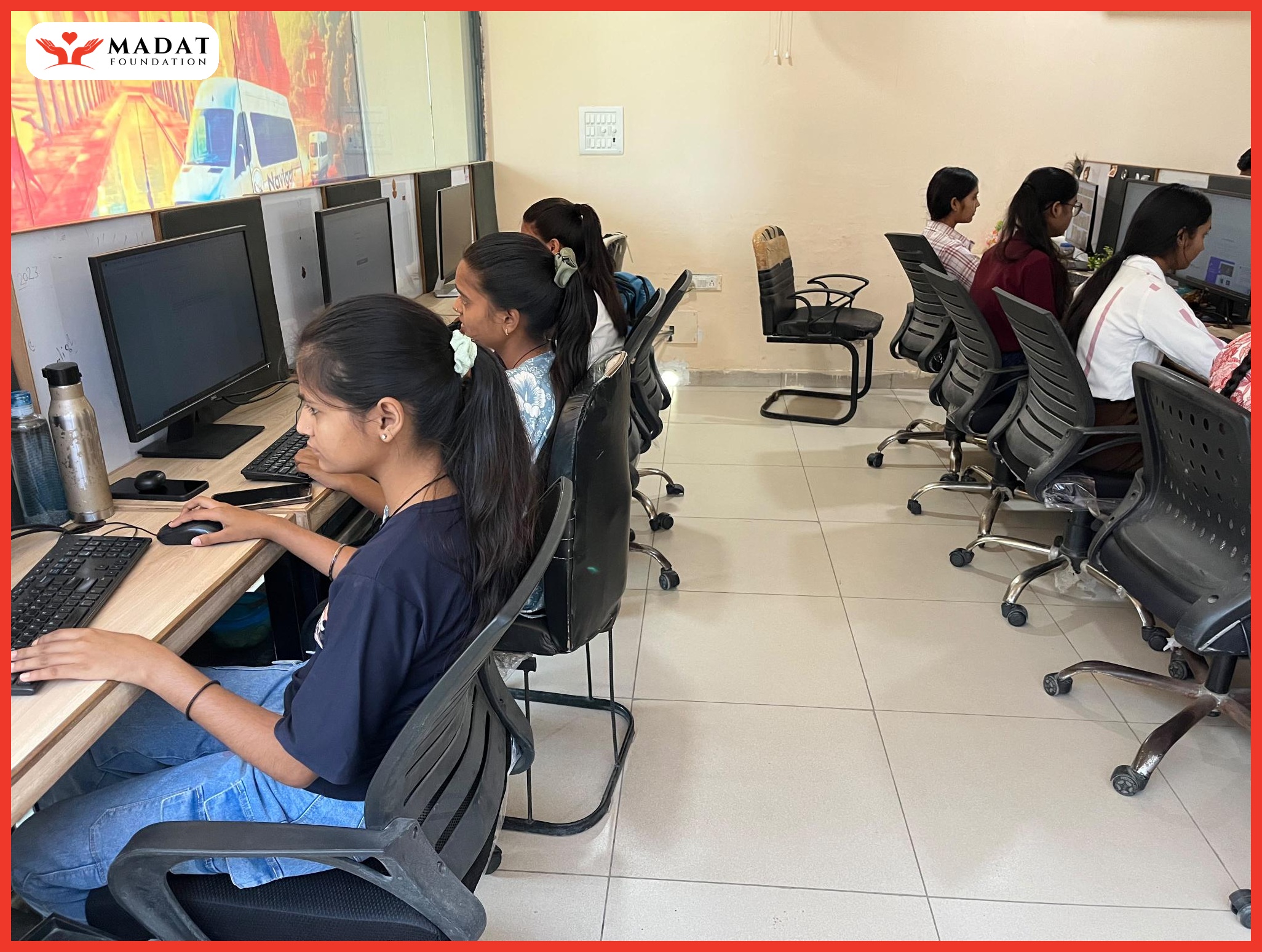 Girls receiving computer skills training at MADAT Foundation computer lab in Jhansi