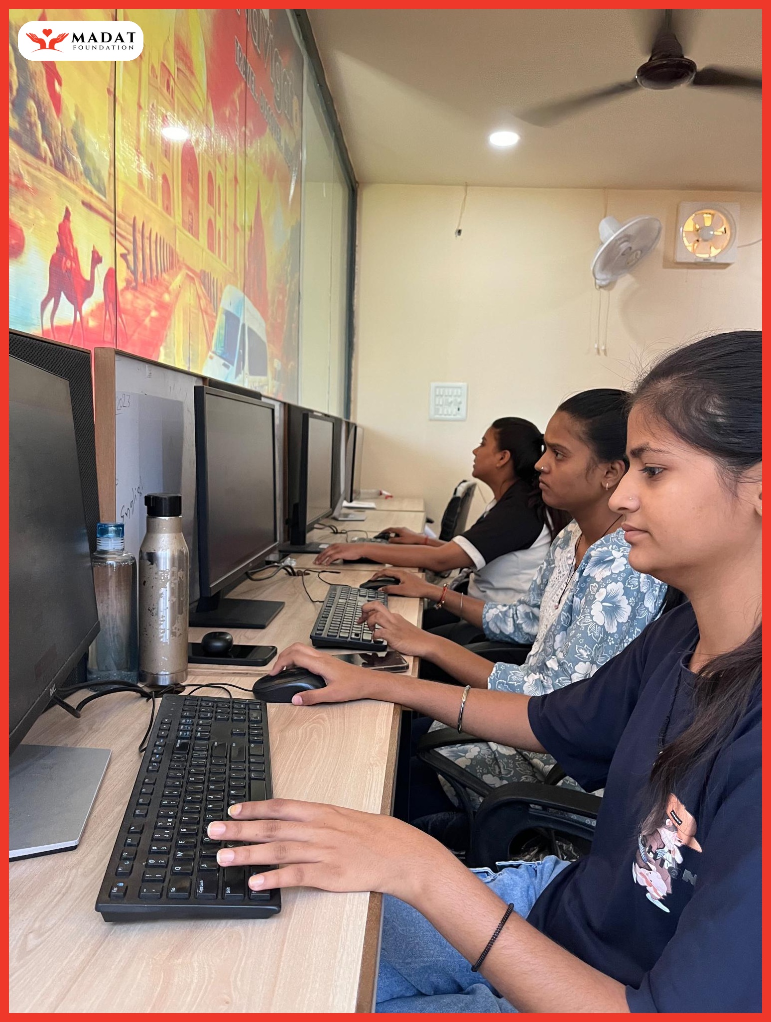 Students learning practical computer skills